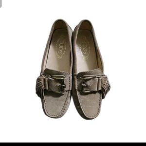 TOD's Gommino Fringed Beige Suede Driving Loafers with Buckle.